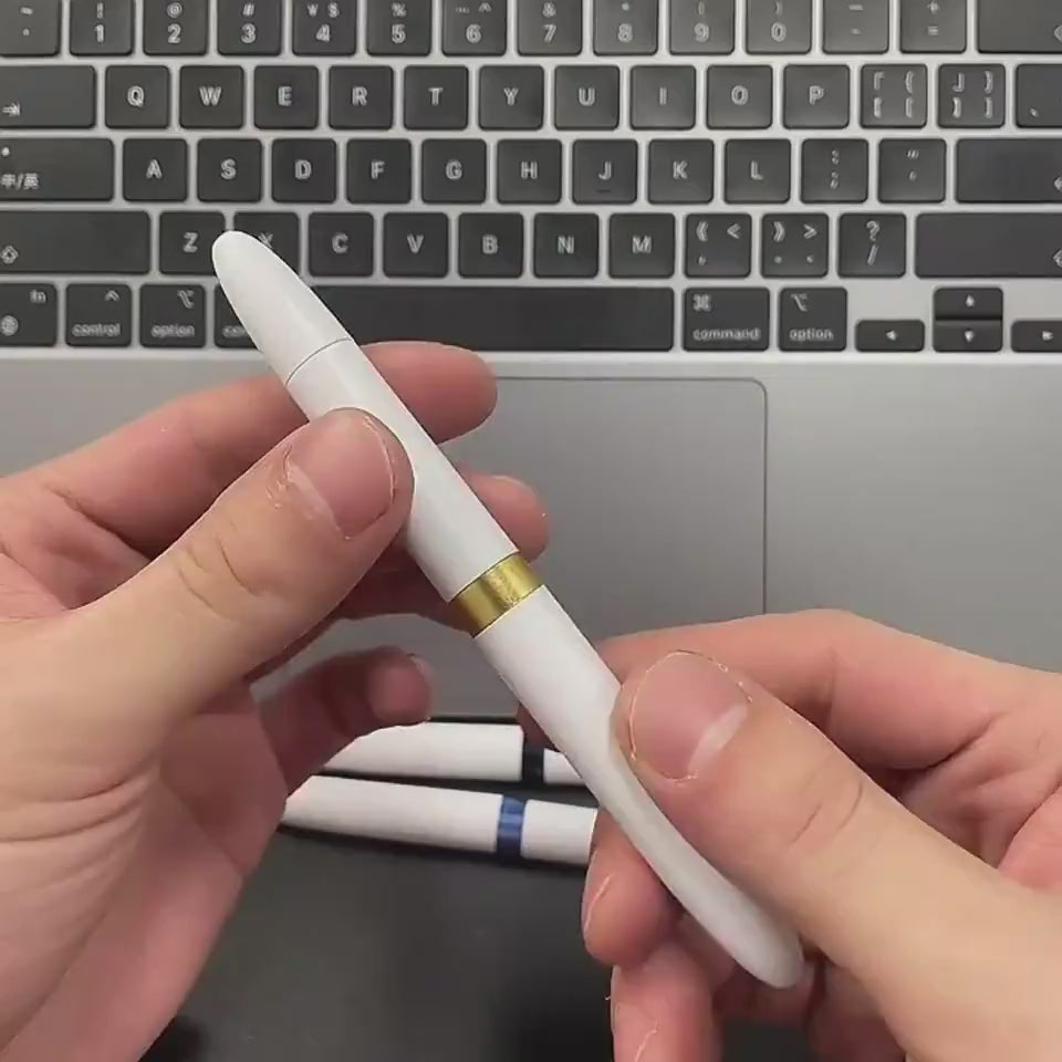 Essential brush kit components including a compact cleaning pen, flocking sponge, and long fine brush for mobile devices and computer keyboards.